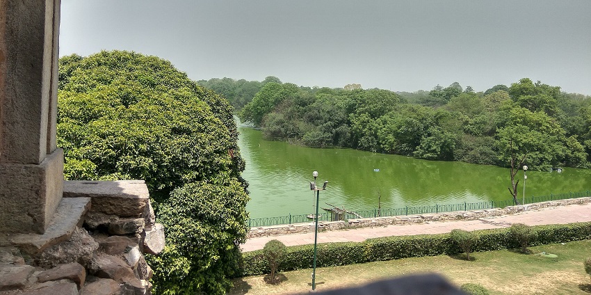 Hauz Khas Village Lake from Hauz Khas Fort with a walking path, one pf the places to visit in Delhi in May.