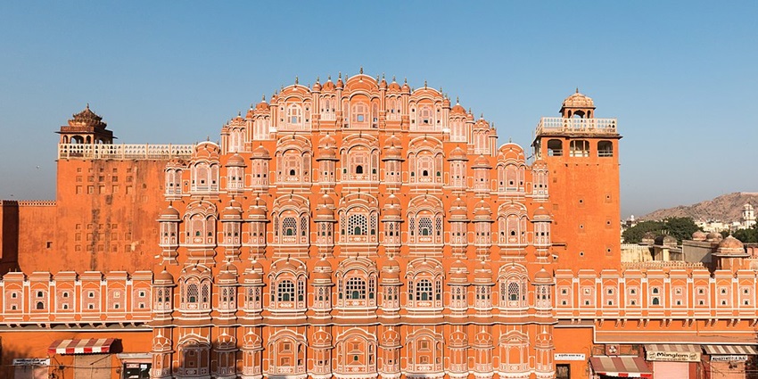Pink sandstone palace with honeycomb windows, among the best places to visit in Jaipur in June.
