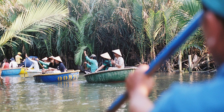 Traditional boat ride on river, showing What Is Vietnam Famous For among travellers