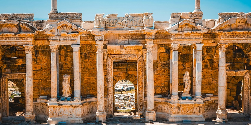White travertine terraces of Pamukkale with Hierapolis ruins, a unique blend among Monuments in Turkey.