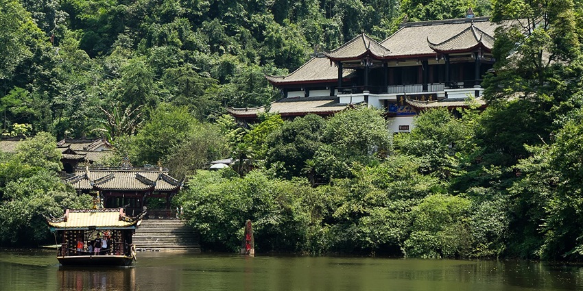 Things to do in Chengdu include climbing lush forest trails and stone steps toward Taoist temples on Mount Qingcheng.