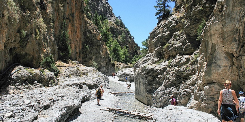 Things to do in Crete, Greece, include trekking through one of Europe’s longest gorges, surrounded by rugged cliffs.