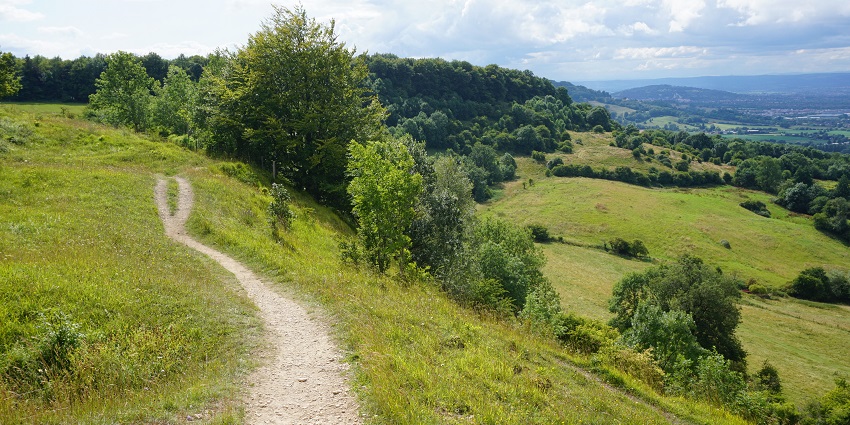 Things to do in the Cotswolds include walking ancient trails winding through rolling hills, charming villages, and centuries-old landmarks.