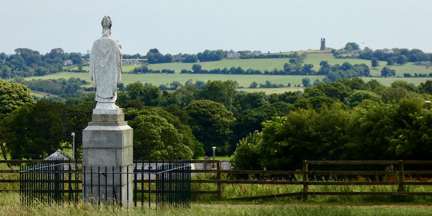 Ancient Hill of Tara in County Meath with green fields and historic burial mounds