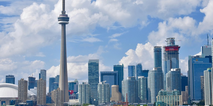 Toronto skyline with CN Tower, comparing city affordability, is Toronto expensive to visit.