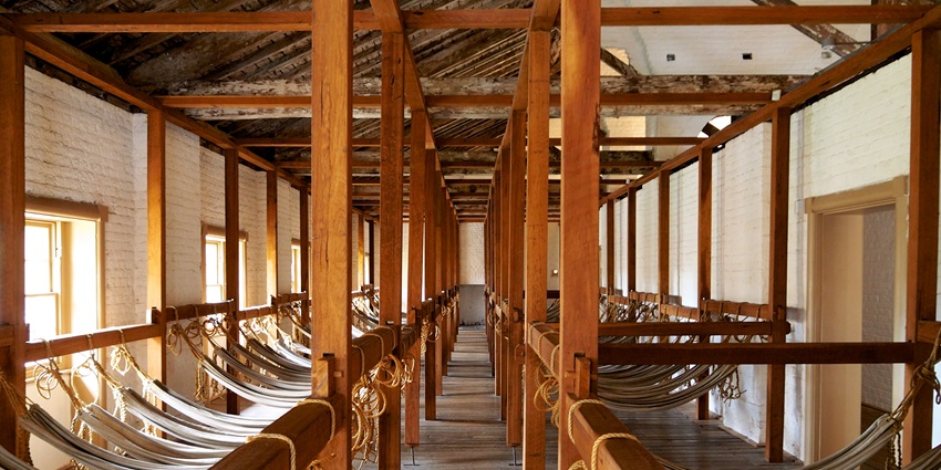 Hyde Park Barracks is a historical place to visit in Sydney, with sandstone architecture.