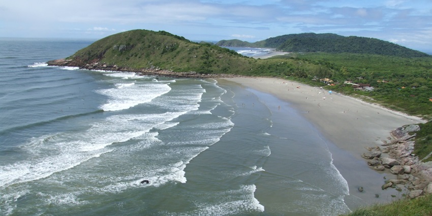 A scenic view of Ilha do Mel island showcasing its lush greenery and serene coastline.