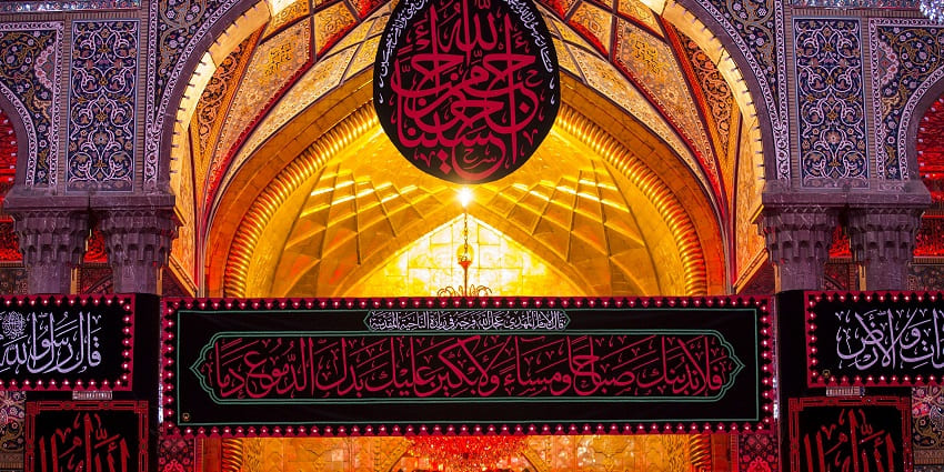 Imam Hussain's shrine in the evening with lit-up minarets, domes, one of the Islamic historical places in Iraq.