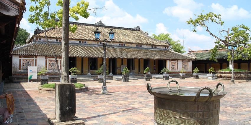 Imperial City of Huế's main gate with traditional Vietnamese architecture under daylight.