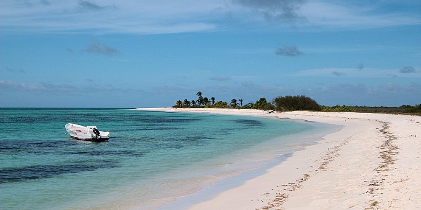 A tiny, remote Caribbean island used mostly for scientific research and marine biodiversity studies.