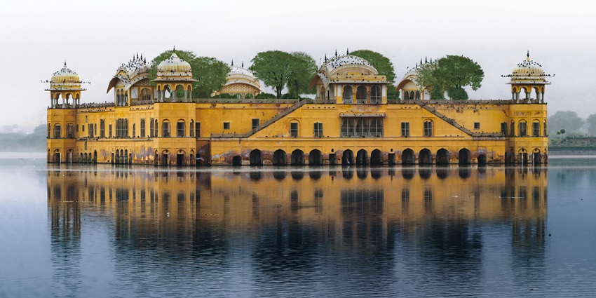 Palace floating in Man Sagar Lake, reflecting elegance against the Aravalli hill backdrop, among the best places to visit in Jaipur in June.