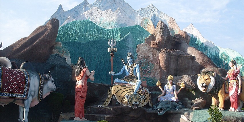 Devi Talab Mandir with red spires and sacred pond in Jalandhar, Punjab.
