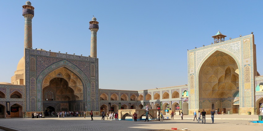 Large brick dome and arched doorway of the Jameh Mosque, reflecting Persian architecture.