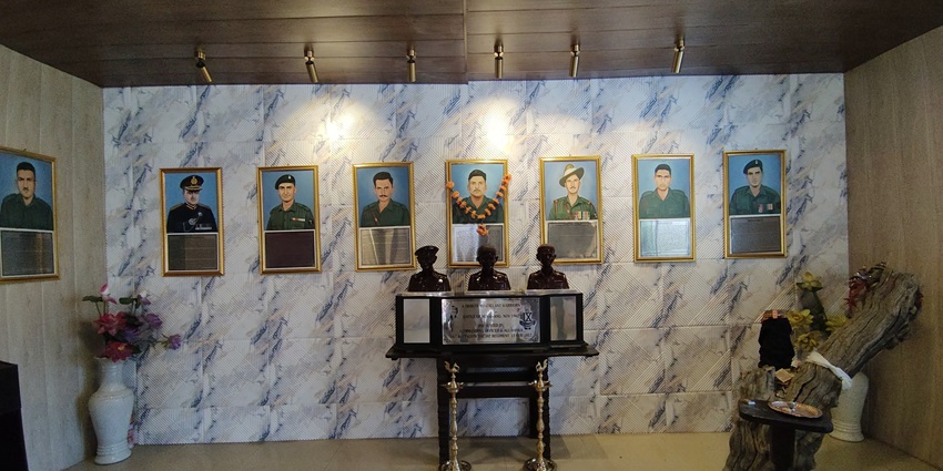 The interior of the Jaswant Garh War Memorial with multiple portraits of soldiers