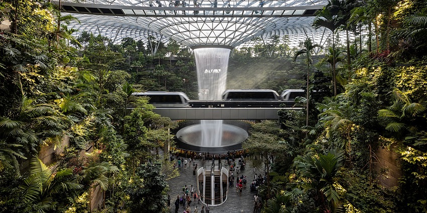 Jewel Changi Airport's stunning indoor waterfall and lush greenery, one of the best places to visit in Singapore in July.
