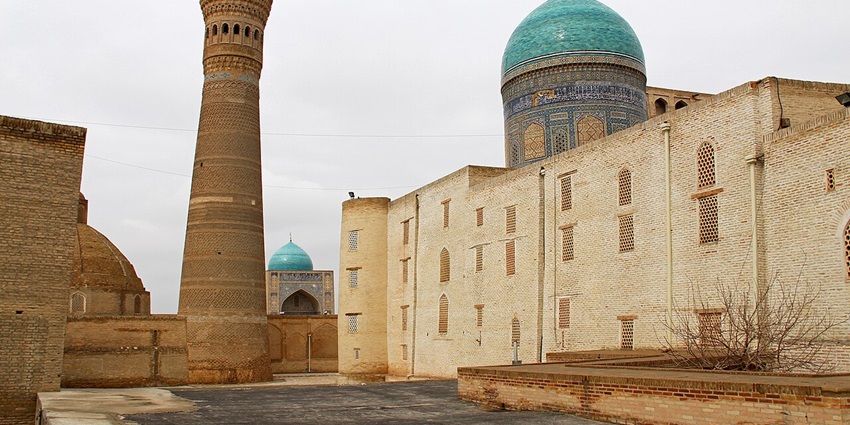 Kalyan minaret with Mir-i-Arab Madrasah, sculptures on the minaret and mosque in the back