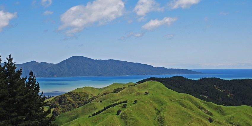 The stunningly beautiful Kapiti Island is surrounded by magical mountains in New Zealand.