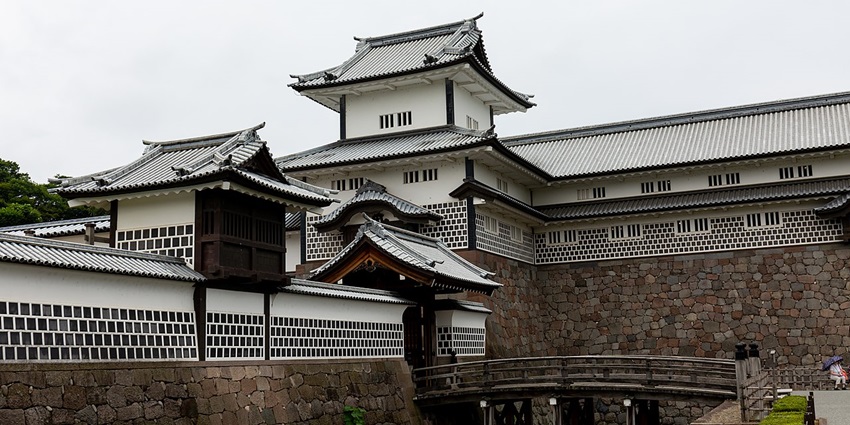 Kanazawa Castle is a traditional Japanese castle under a clear spring sky, one of the historical places in Japan.