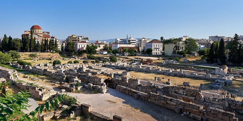 Ancient tombs and marble statues at Kerameikos Cemetery in a peaceful archaeological site.