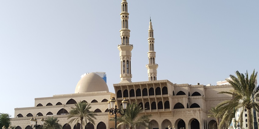 King Faisal Mosque in Sharjah with modern Islamic architecture, two minarets and stairs