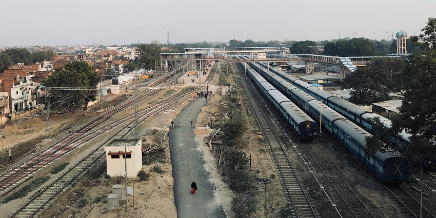 Image of Kottayam Station with trains near the platform.