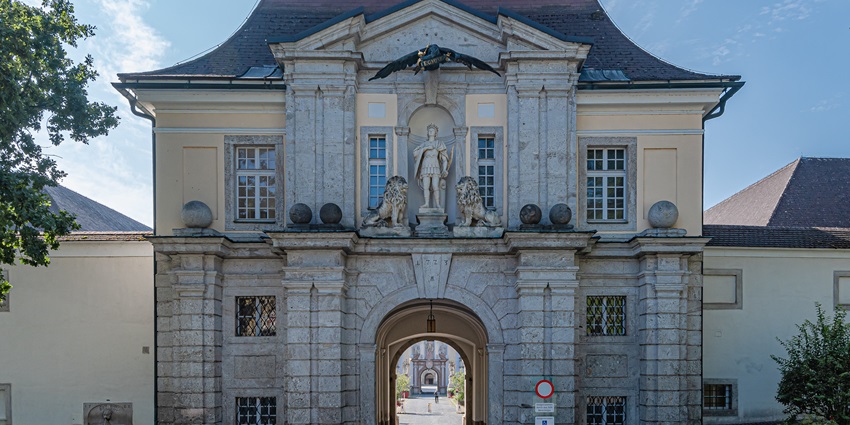 Historic Kremsmünster Abbey with baroque architecture and scenic surroundings.