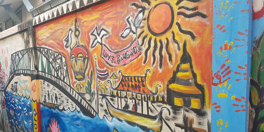 Wall of the Kudi Chin community with unique paintings portraying river, lotus and bridges.