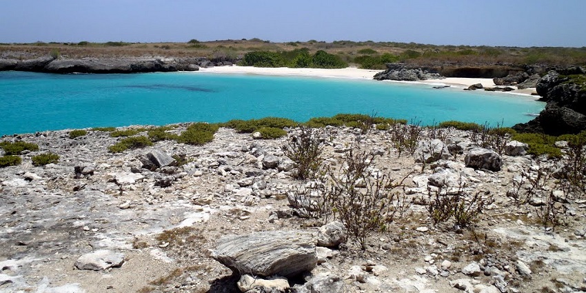 A rarely visited island known for its white-sand beaches, coral reefs, and marine life sightings.