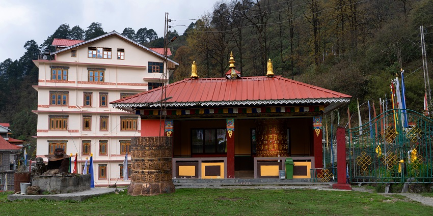 Small Buddhist monastery with prayer wheels, a peaceful place to visit in Sikkim in August.