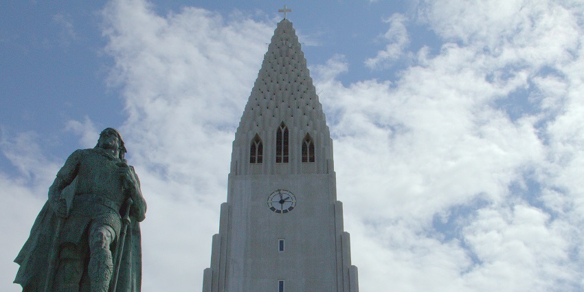 The Leif Erikson Monument in Reykjavík, Iceland, stands tall under a clear blue sky.