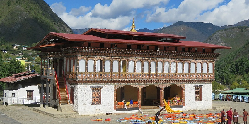 Lhakhang Karpo in Haa Valley with traditional architecture and red roofs, one of the places to visit in Bhutan in February.
