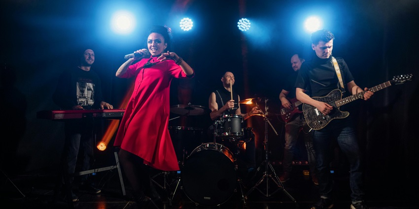 Musicians performing on stage while crowds enjoy live music at a local Conshohocken venue.