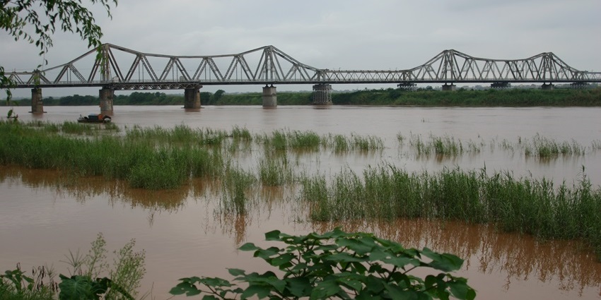 The Historic steel structure of Long Bien Bridge over the Red River is a historical places in Hanoi