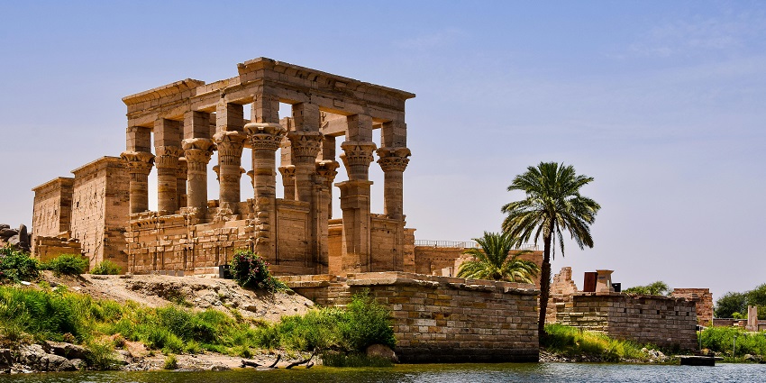 Image of the Luxor Temple and mosque in Egypt, surrounded by palm trees, one of the most beautiful historical places in Egypt.