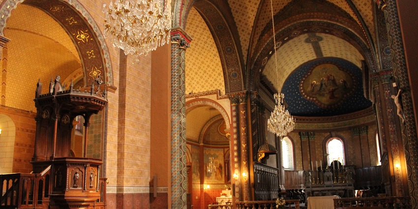 Interior of Cathédrale Saint-Jean-Baptiste with detailed architecture, one of the historical places in Lyon.
