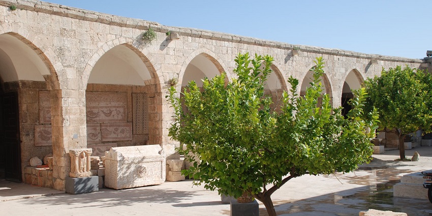 Maarrat al Numan Museum with traditional architecture, stones and small green trees
