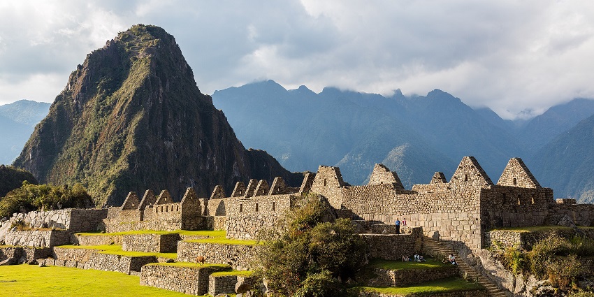 Machu Picchu in the Cusco region, with the ancient architecture of the city, and mountains, one of the historical places in Peru.