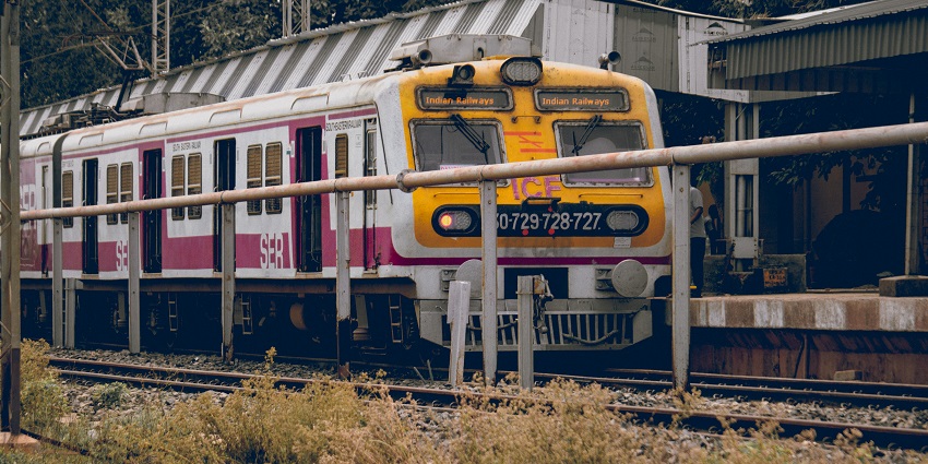 Malabar Express train at a railway platform on a clear day