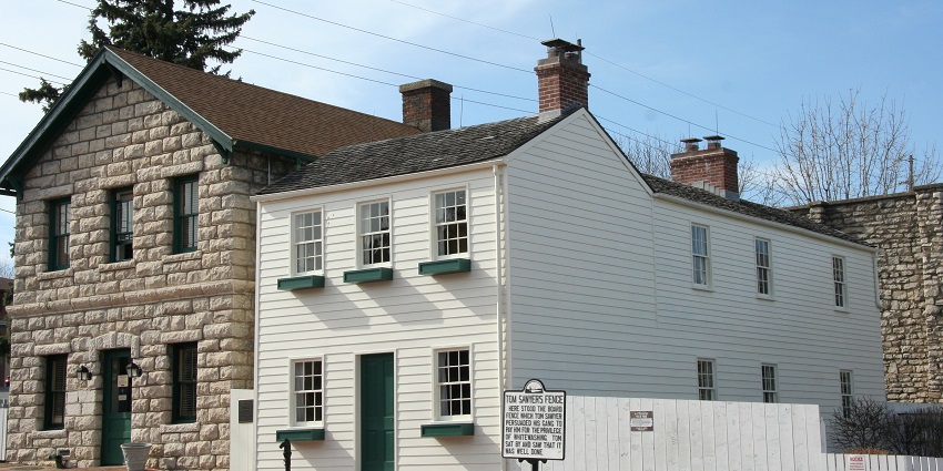 Mark Twain Boyhood home and museum with sign boards, lamps, one of the historical places in Missouri.