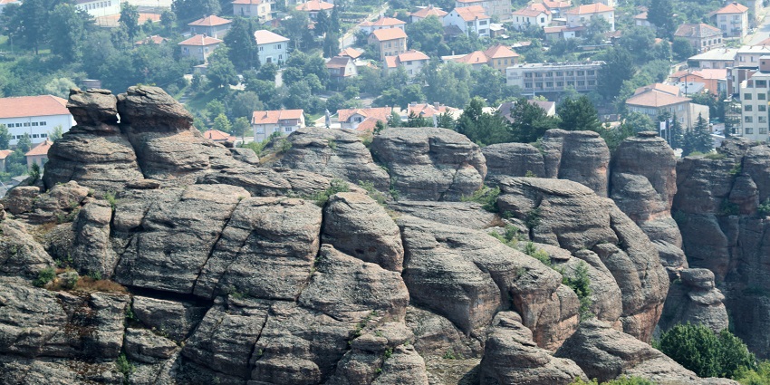 View gravity-defying rock formations surrounding an ancient fortress in northwest Bulgaria.