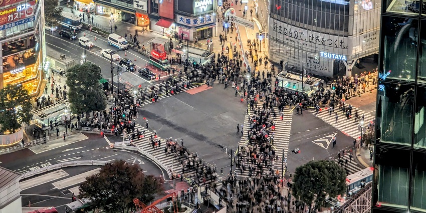 Shibuya Scramble Crossing, featuring fewer crowds, high police presence, and a lively atmosphere, showing various things to do in Shibuya.