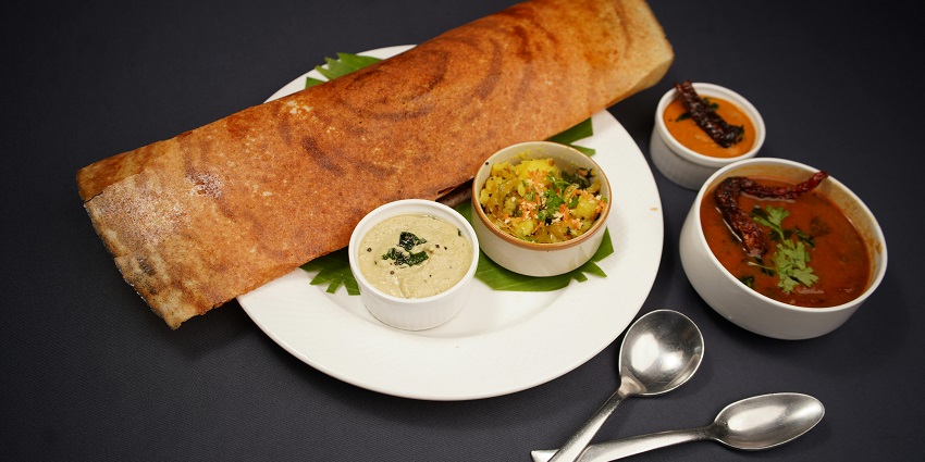 Masala Dosa, a crispy South Indian crepe filled with spiced potatoes, is part of what is famous food in Bangalore.