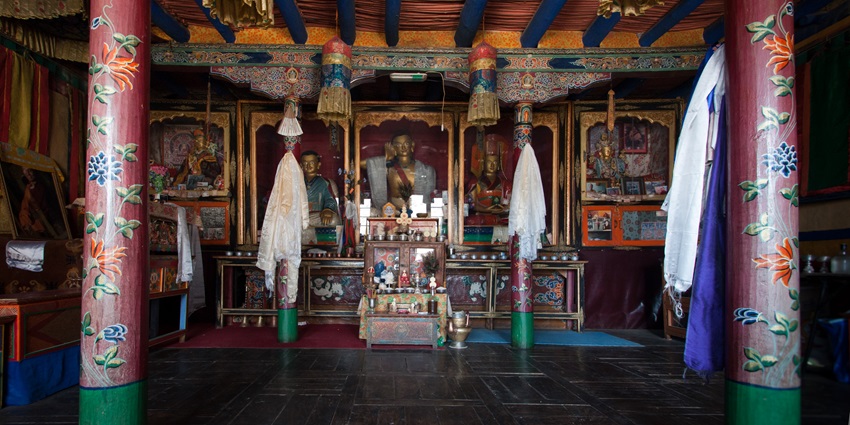 Inside the Matho Monastery, a majestic Buddha Idol, adorned in Tibetan Buddhist tradition.