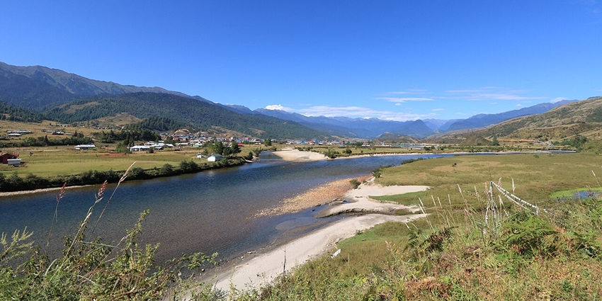 Mechuka in Arunachal Pradesh has with clear water body, and lush green mountain views.