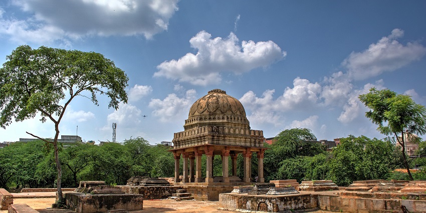 Mehrauli Archaeological Park with old Islamic architectural structures and dense greenery