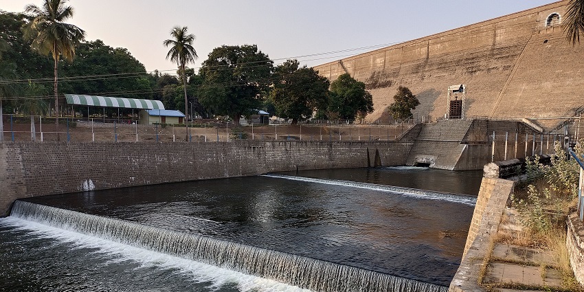 Massive dam on the Cauvery River with adjacent parklands and viewpoints for tourists.