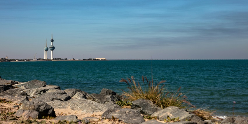 Historic lighthouse and calm seas surrounding the quiet Miskan Island, one of the top islands in Kuwait.