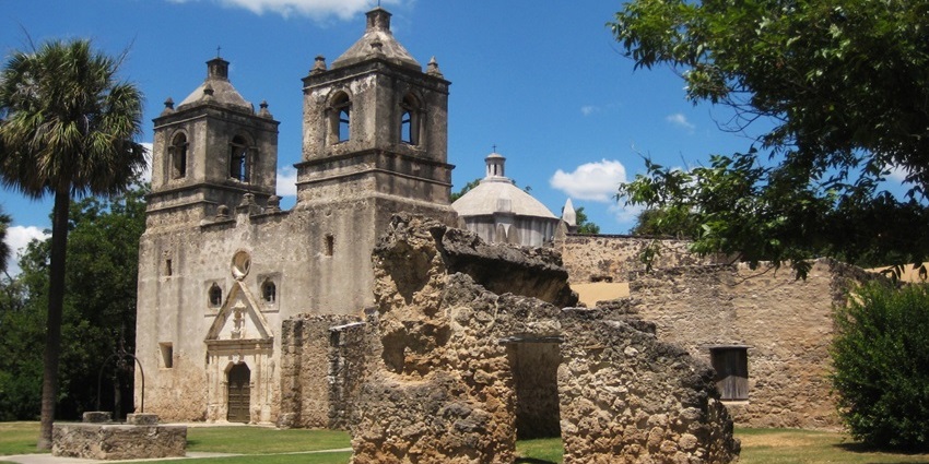 Mission Concepcion, with old, broken walls of the building, small windows, one of the historical places in San Antonio.