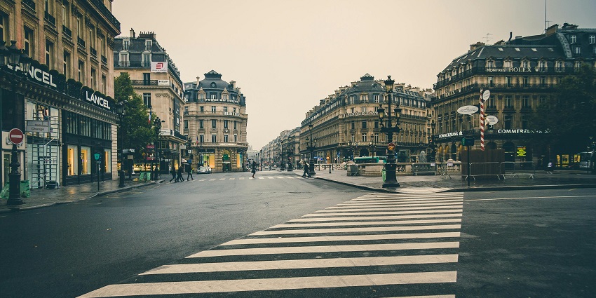 Modern retail stores and shoppers in central Paris showcase where to shop in Paris.