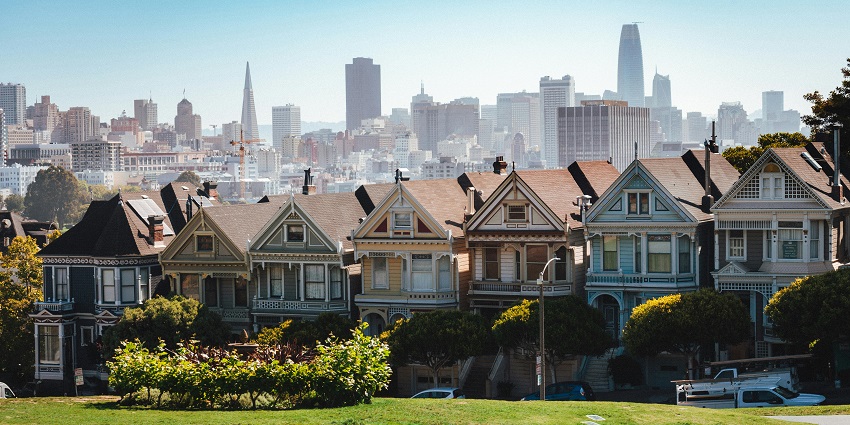 Historic buildings in San Francisco under a soft evening glow, evoking lasting travel memories.